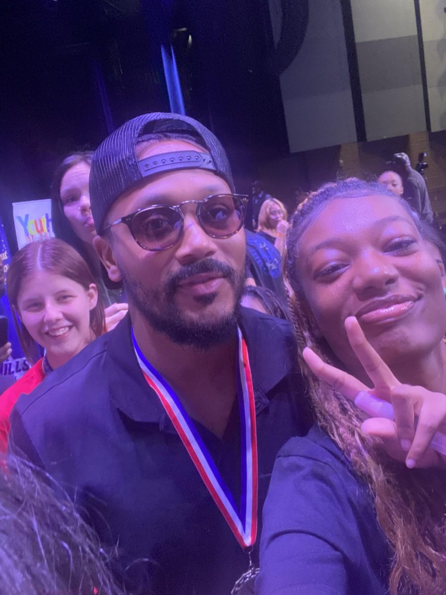 Israel Martin poses with Romeo Miller.