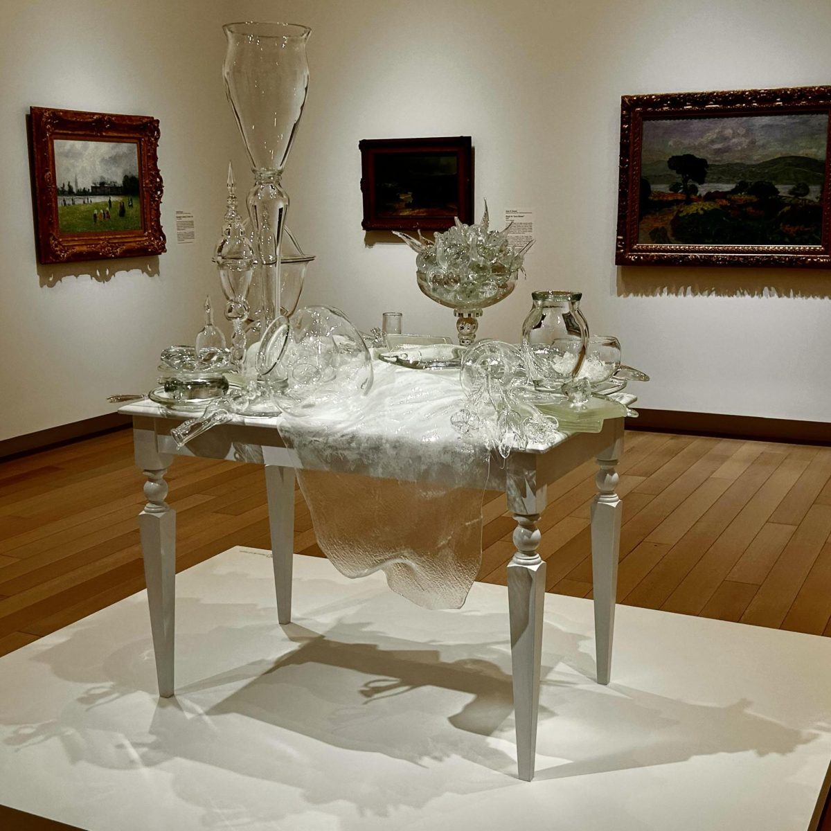 A table holding glass objects located at the Arkansas Museum of Fine Arts in Little Rock, Arkansas. 