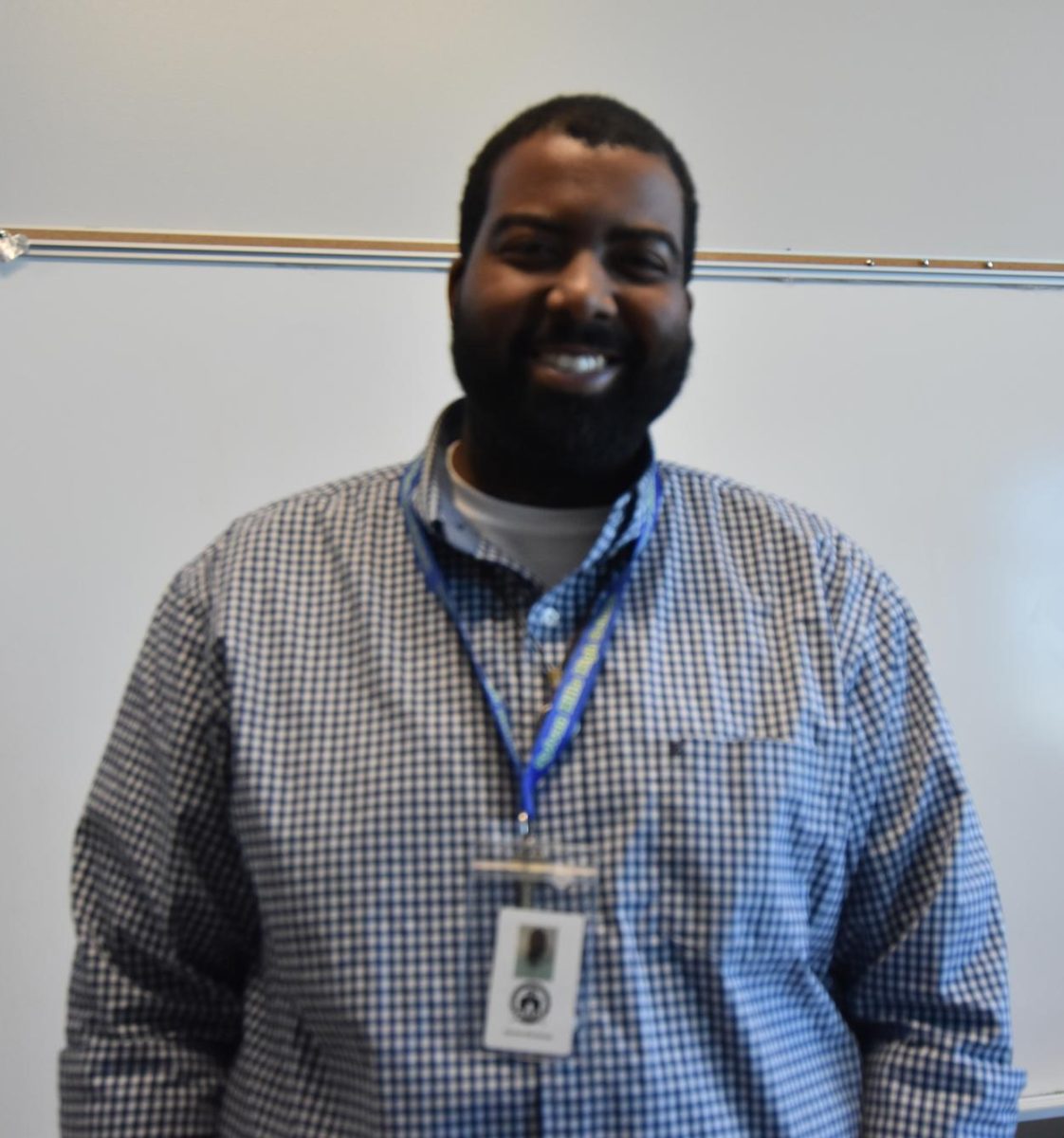 Mr. Brockman poses for the camera in his room on the third floor. Mr. Brockman has taught Biology to 10th and 11th graders this year.