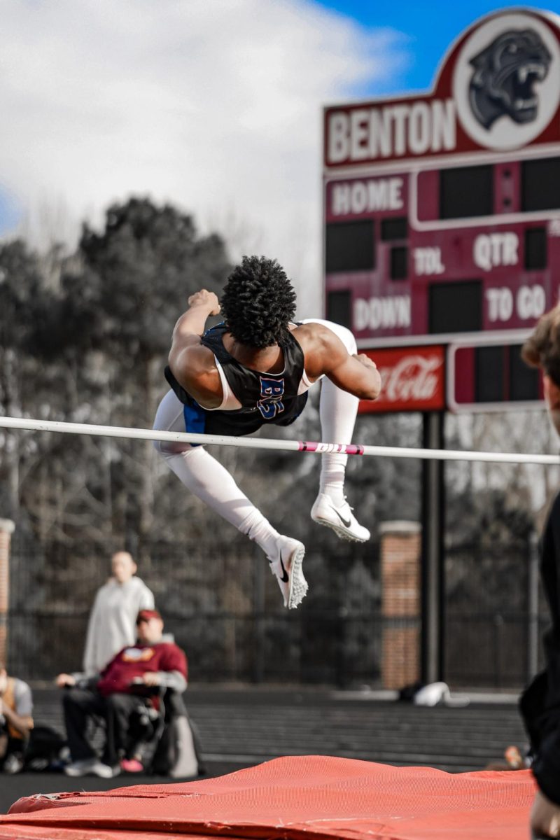 Junior Lakobe Brent high jumps during the Benton meet. As a team, the boys finished 5th.