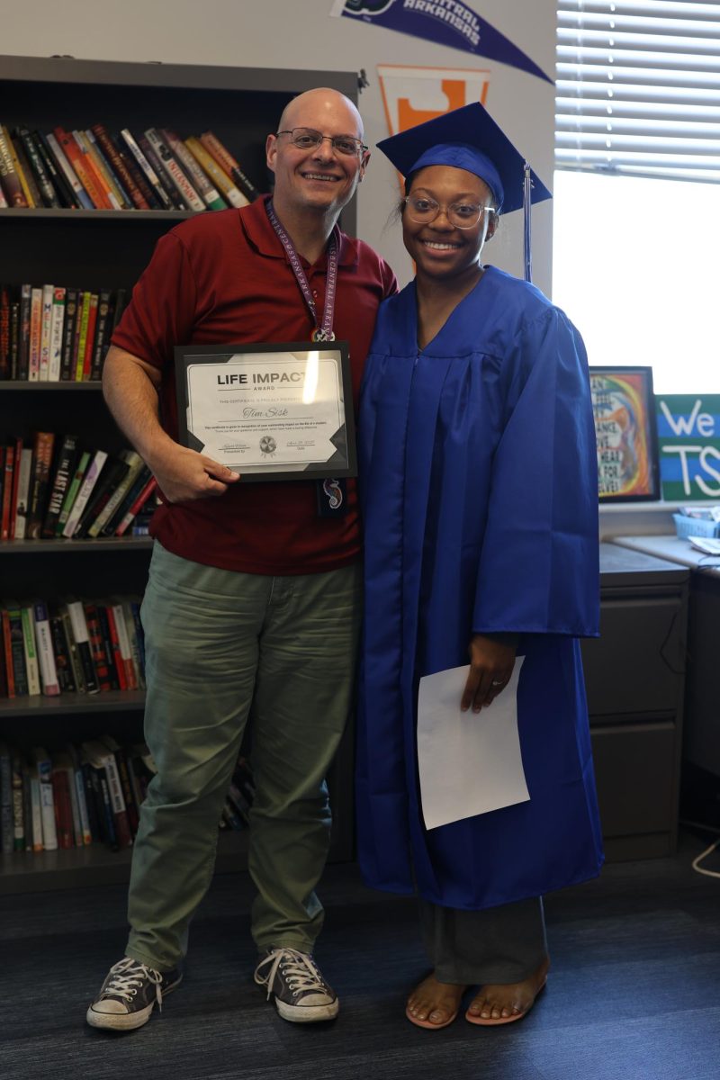 Senior Makyiejah Wilson poses with English teacher Mr.Sisk 
