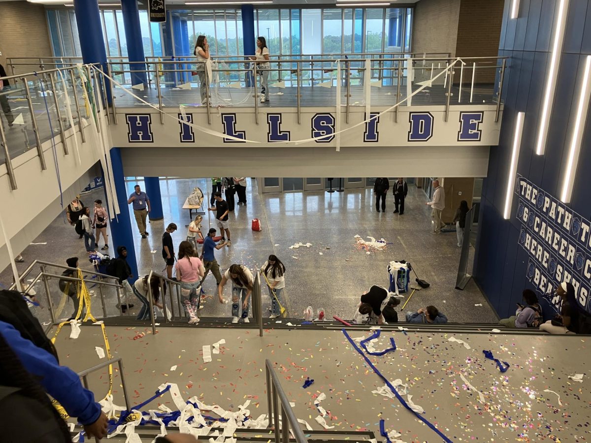 Class of 2026 Juniors clean-up after completing take over. Class of 2026 Juniors spent their morning wrapping and decorating the halls to building 12, paving their way to their senior year. To mark the end of their take-over, they ran the halls. And then, to really mark the end of their take-over, they cleaned up. 