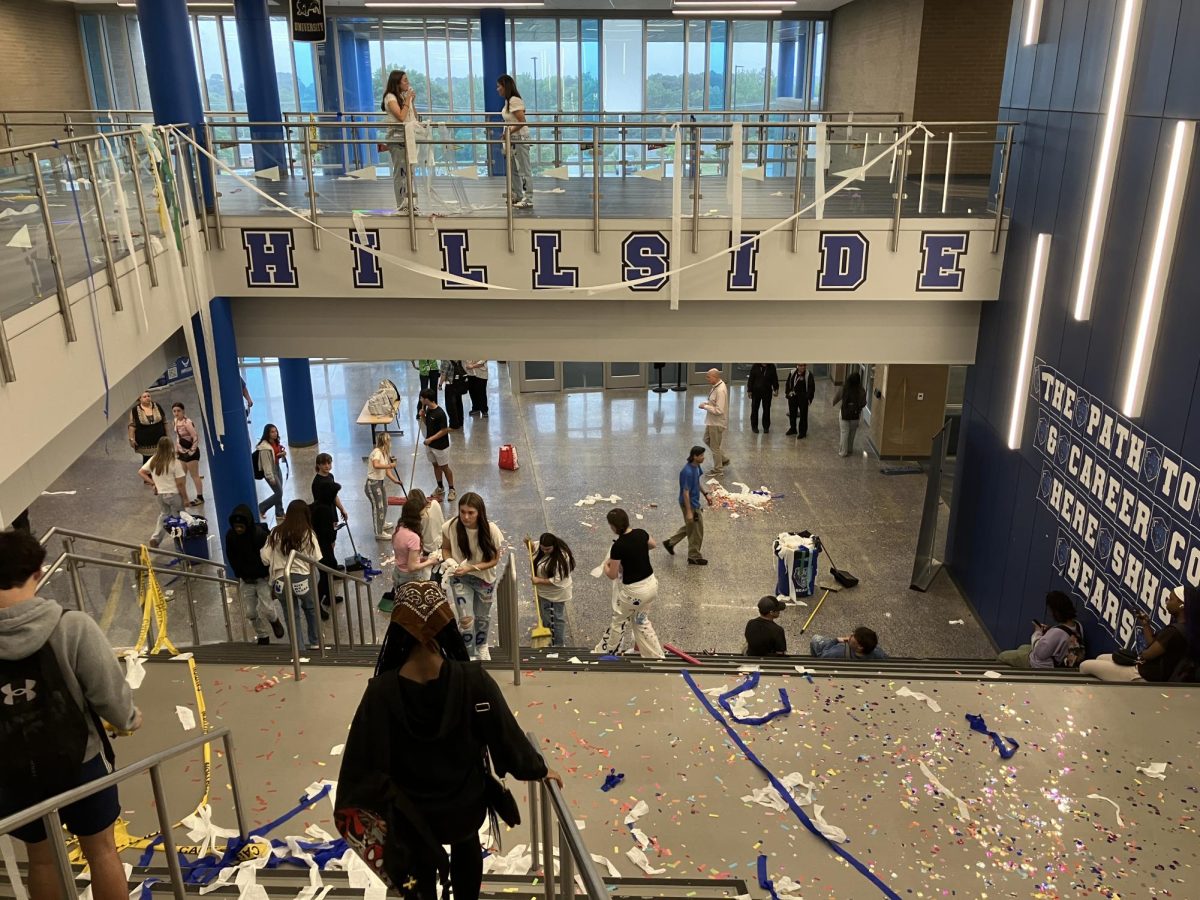 Class of 2026 Juniors clean-up after completing take over. Class of 2026 Juniors spent their morning wrapping and decorating the halls to building 12, paving their way to their senior year. To mark the end of their take-over, they ran the halls. And then, to really mark the end of their take-over, they cleaned up. 