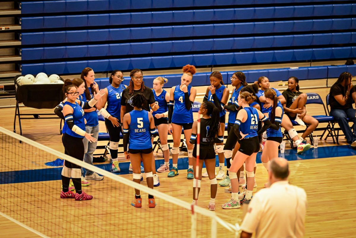 Coach Muhammad gives speech in team huddle after a set
