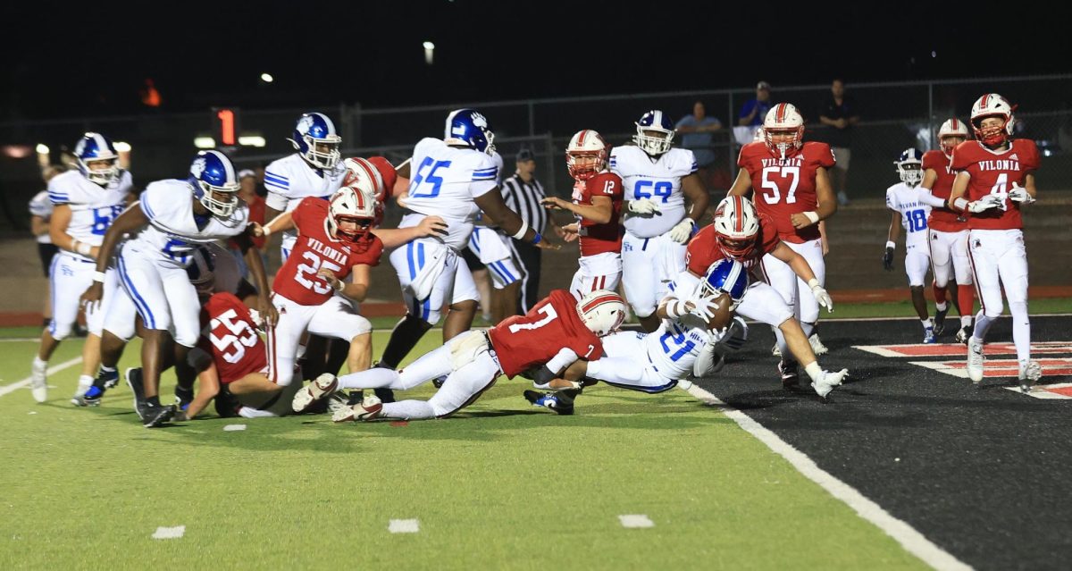 Junior Jeremiah Carey (21) scores against the Vilonia defense on Friday. The Bears defeated the Eagles 46-14 and are set to play Russellville at home Friday. 