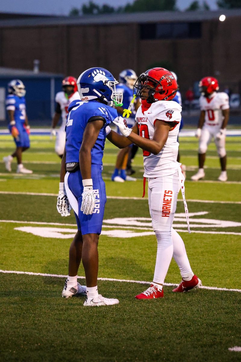 ____ faces off with a Maumelle Hornet after the play was called by the refs. 