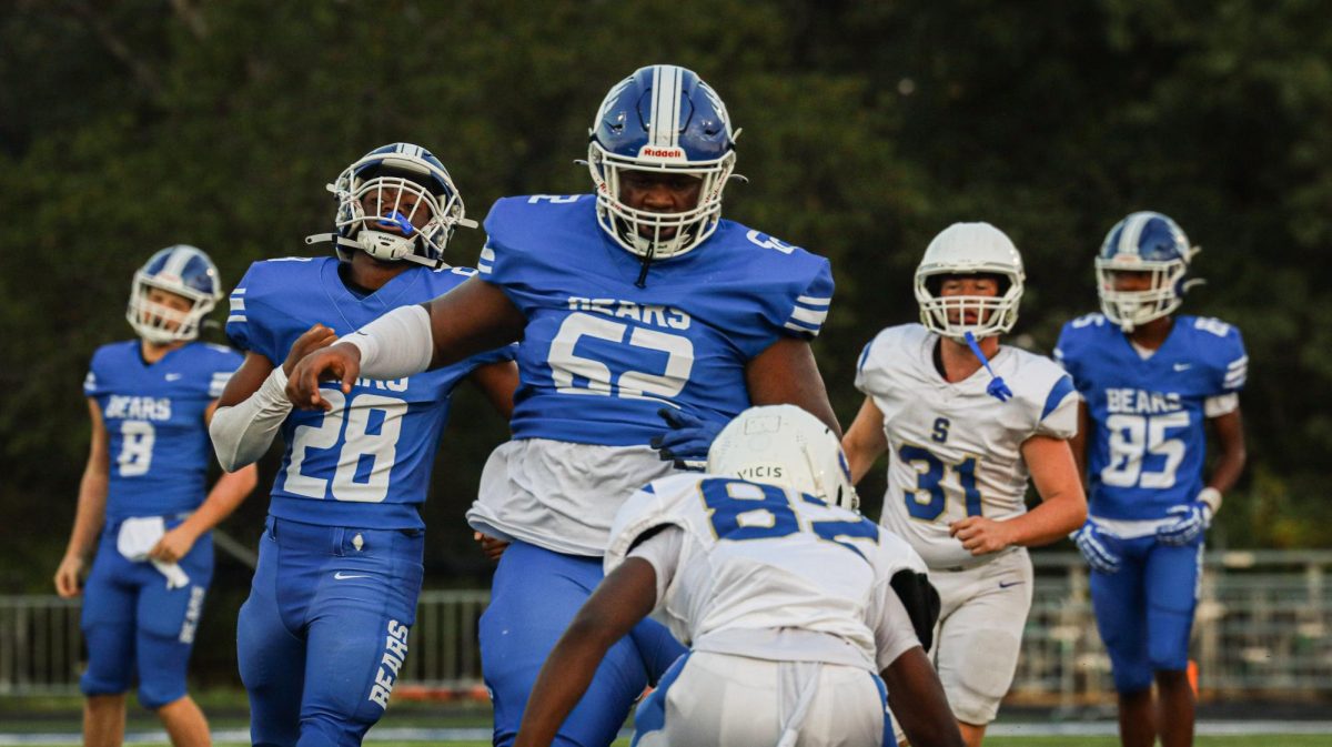 Korda' Fulton (11) and the SYlvan Hills JV offense lead a rushing block against Sheridan.