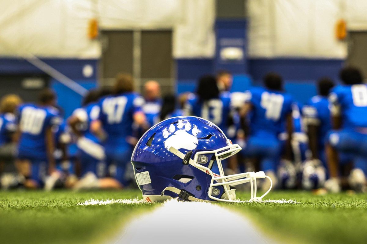 In the field house, the Bears meet with coaches during halftime. Sylvan Hills won 50-0 against Russellville.
