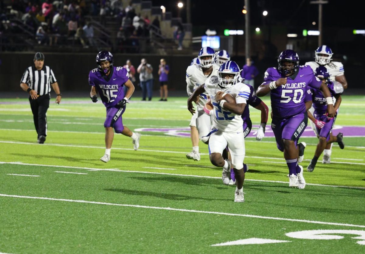 Junior Isaiah Howell breaks through on his way to scoring a touchdown against El Dorado. Sylvan Hills won 25-10.