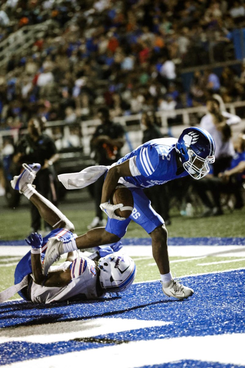 Isaiah Howell (11) runs a 15 yard touchdown against West Memphis last Friday Night. 