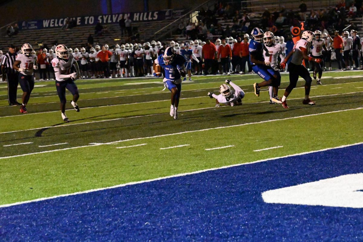 Senior Tyler Blakely (2) scores one of his three touchdowns as the Bears take the lead for good on this play. Blakely led the receiving corpse with scoring three touchdowns on 11 receptions for 259 receiving yards. Sylvan Hills bested Marion 34-32 to make it to the quarterfinals of the state playoffs.