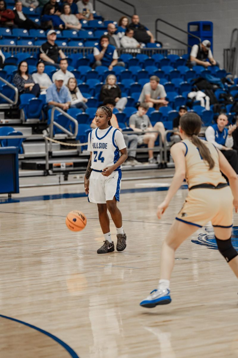 McKenzie Johnson (11th) dribbles the ball down the court vs. Sheridan. Lady Bears win 60-48