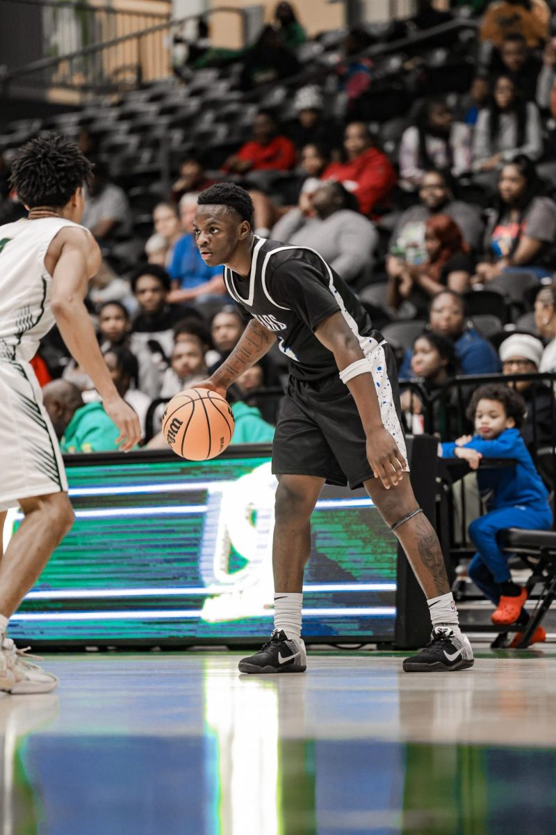 Deryeus Fowlkes (12th) sizes his man up before attempting to score, Bears win 62-58 vs. Mills