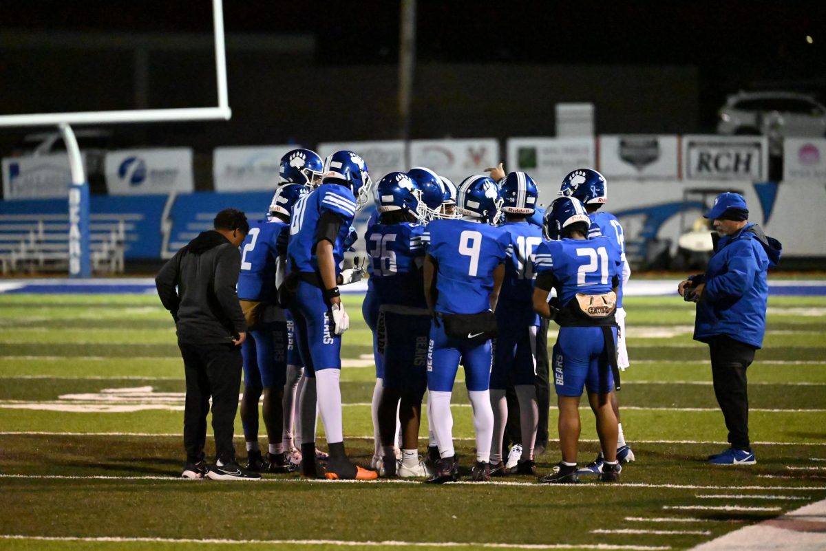 Bears huddle together during timeout. Bears lose 28-52.