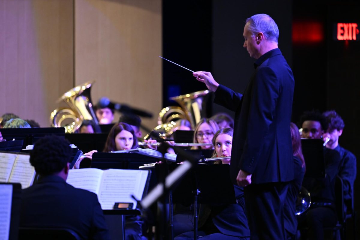 Mr. Bailey conducts the senior high band during the Winter Concert, December 8. 