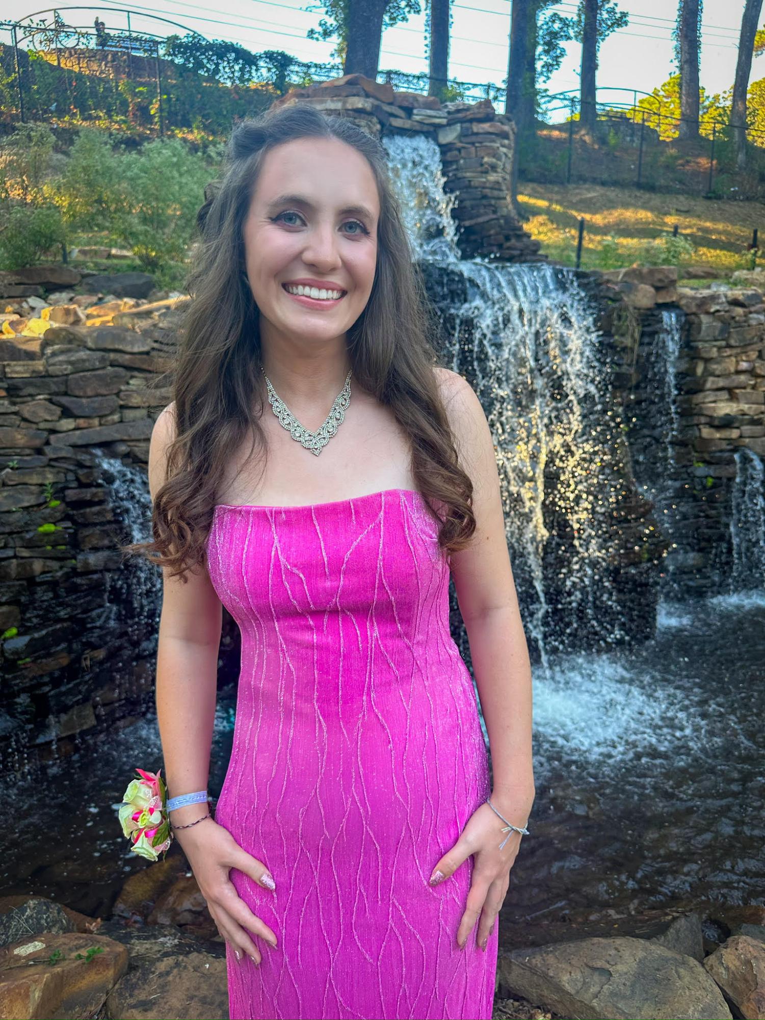 Bella Howell (12) takes time out of homecoming festivities to visit the Old Mill. This year, Howell took on the responsibility of being the yearbook's senior editor. 