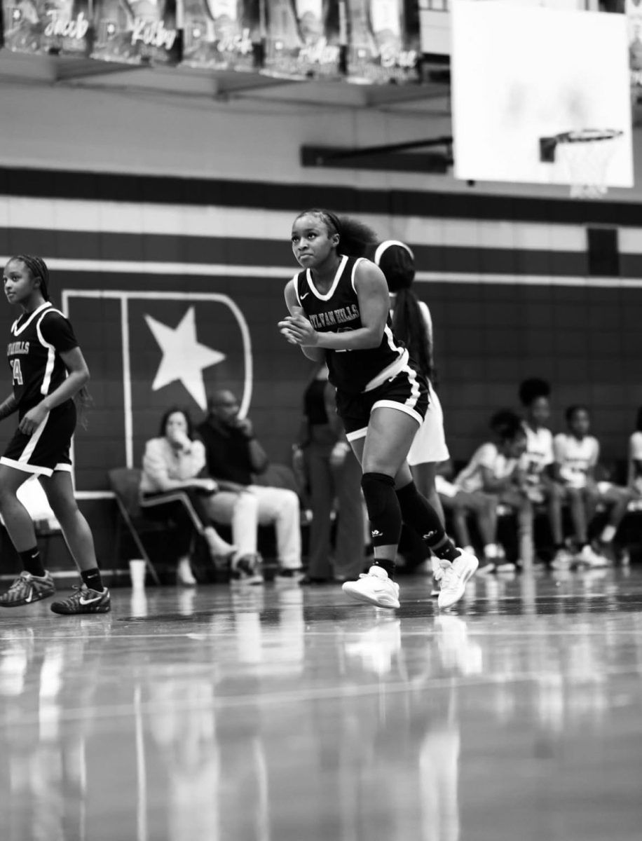 Saniya Miller (12th) celebrates after making a shot vs. Parkview the Bears won 52-37