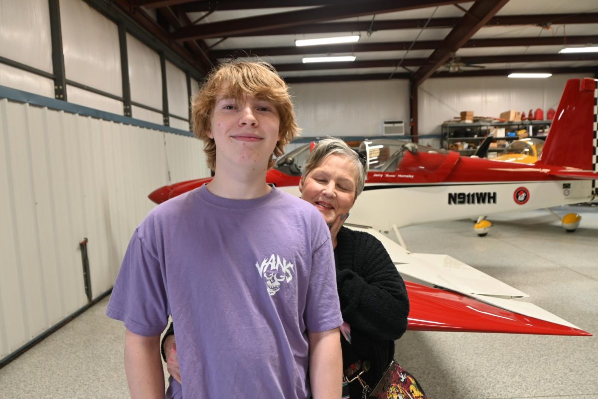 Junior Jonah Freshley poses with his grandmother Victoria, who expressed concern when hearing the airplanes referred to as "home-built." 