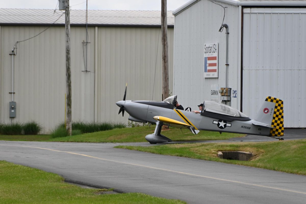 Sophomore Liam Fisher enjoys the breeze as his pilot prepares to taxi to the runway. 
