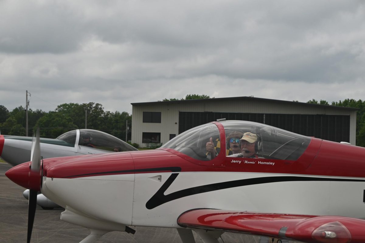 Junior Jonah Freshley prepares to take flight with pilot Jerry "Homie" Homsley at North Little Rock Municipal Airport. 