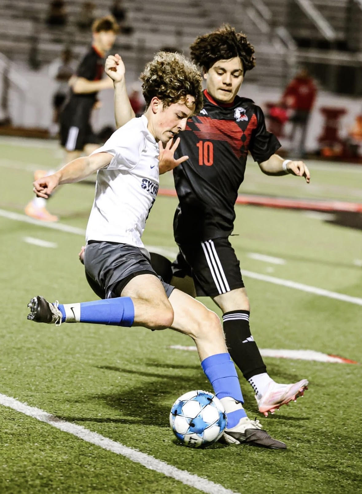 Junior Daniel Prime tries to get past a defender, Tue, Apr 14 bears lose 3-1