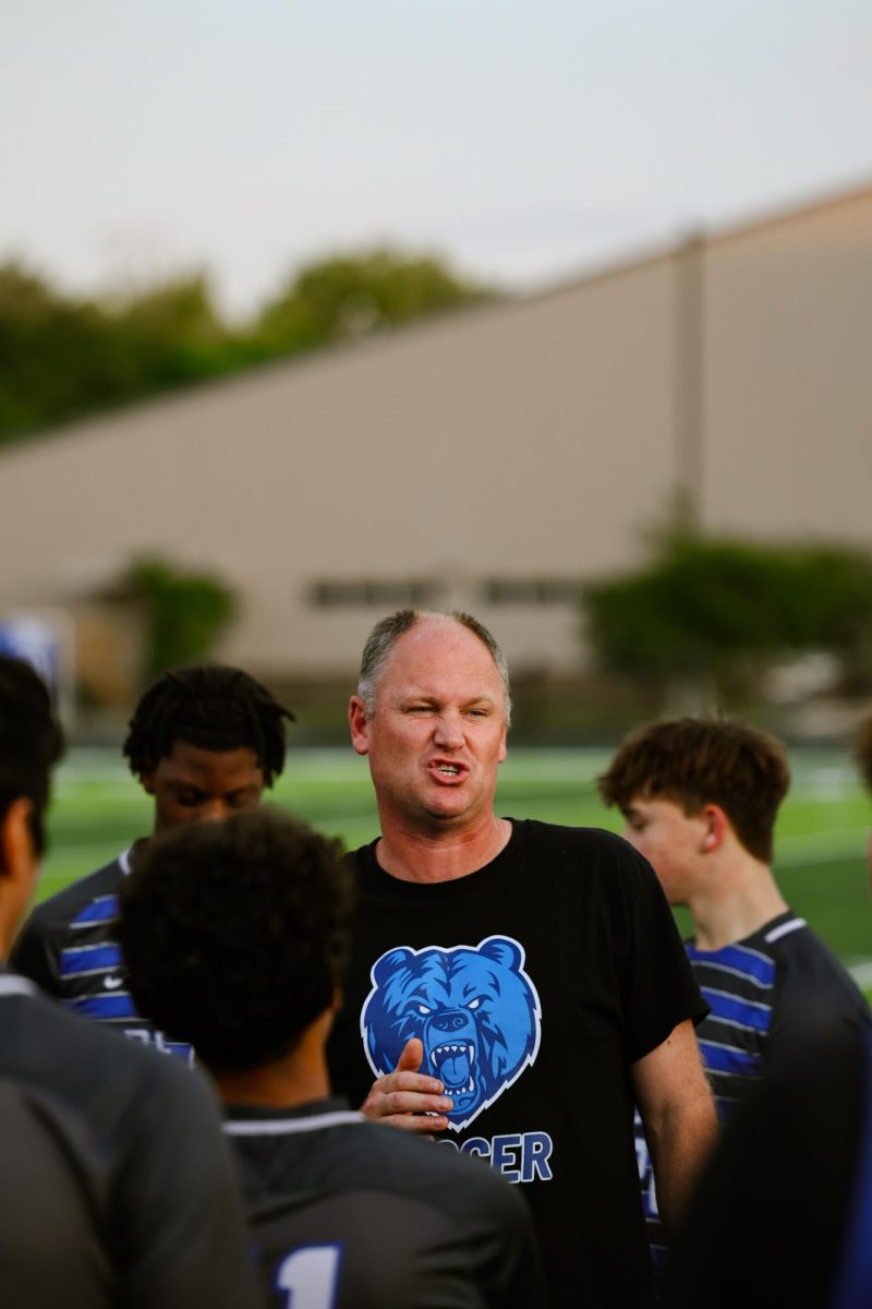 Coach Sam gives the team an encouraging speech during halftime against the Beebe Badgers.