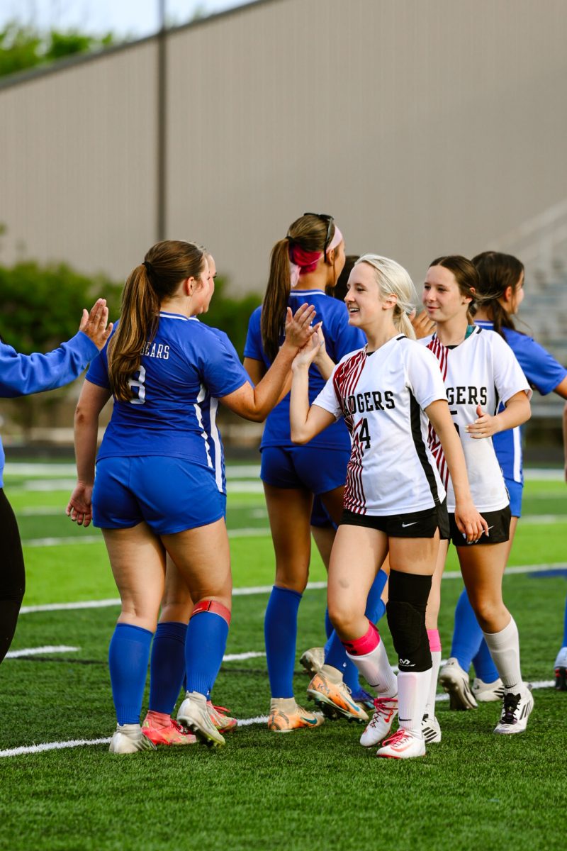 Sylvan Hills Lady Bears shake hands with the Beebe Badgers after the Lady Bears' win 